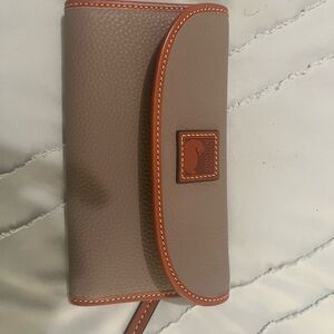 Dooney shoulder bag with checkbook wallet.  Purse used less than 2 times